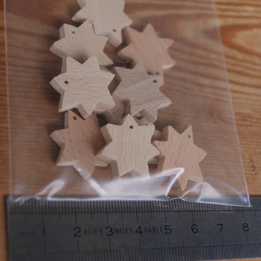 Miniatyrstjärna med 7 genomborrade grenar, juldekoration att dekorera och hänga upp.